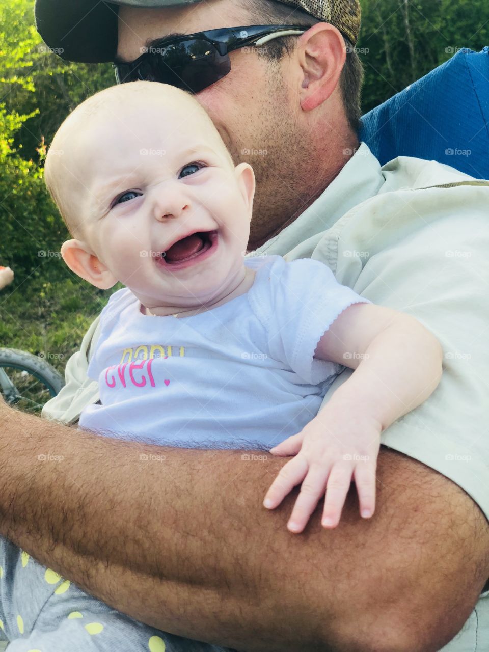 Baby smiling with dad