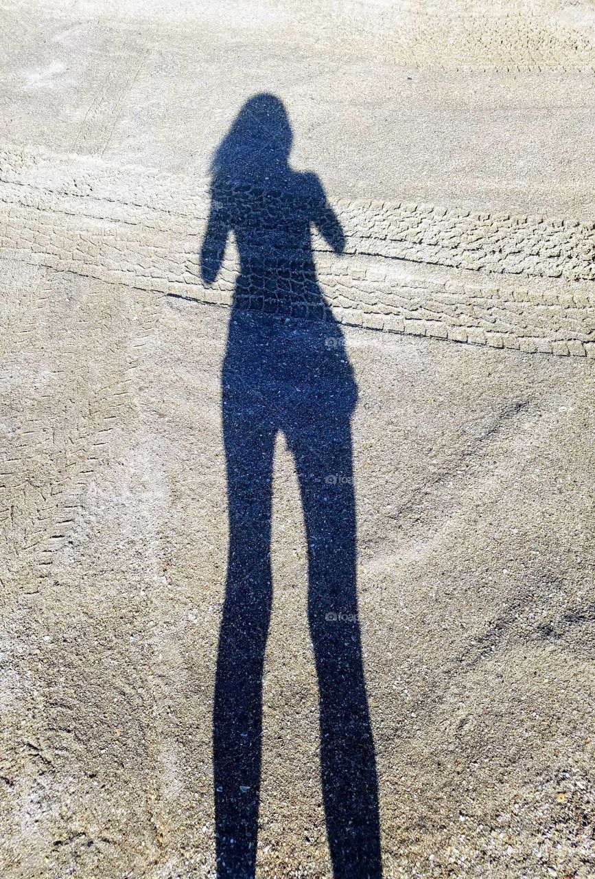 This shadow is awesome because it makes me taller and gives me a boost on the "back side" :) but seriously was taken on accident trying ro catch a bird and I felt like posting to show the beach that is now gone from Florence.