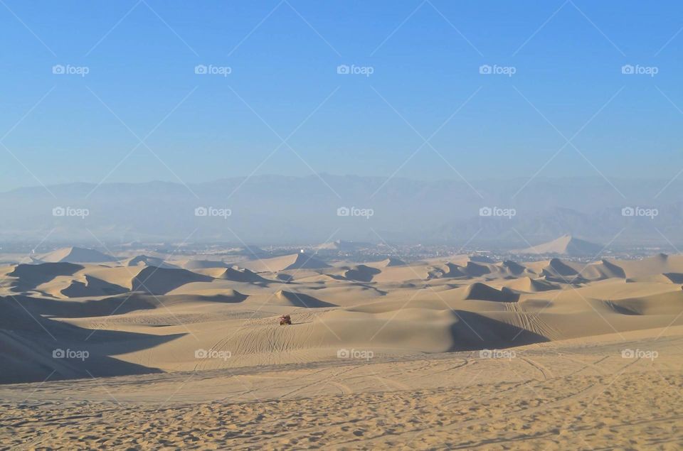 A day of sand boarding in the enchanting oasis of Huacachina, somewhere in the Ica region of Peru.