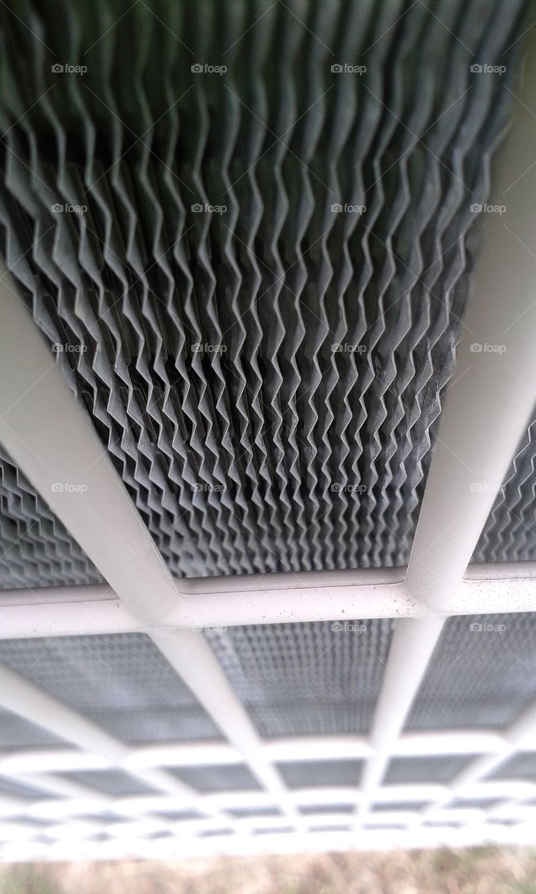 Ruffled cage grate. This is the surrounding grate enclosing the cooling unit
