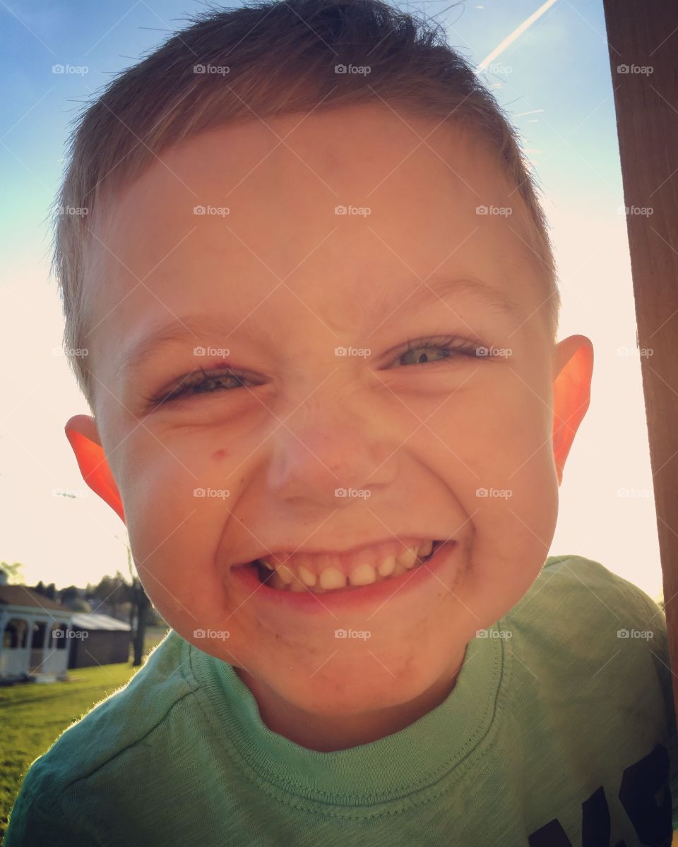 Close-up of a little boy smiling