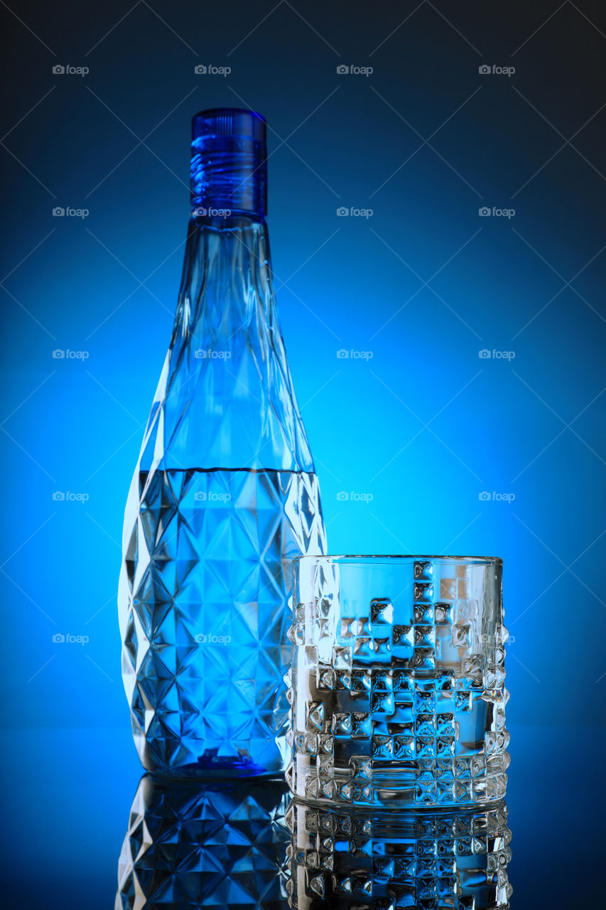Clean mineral / drinking water in a glass and bottle