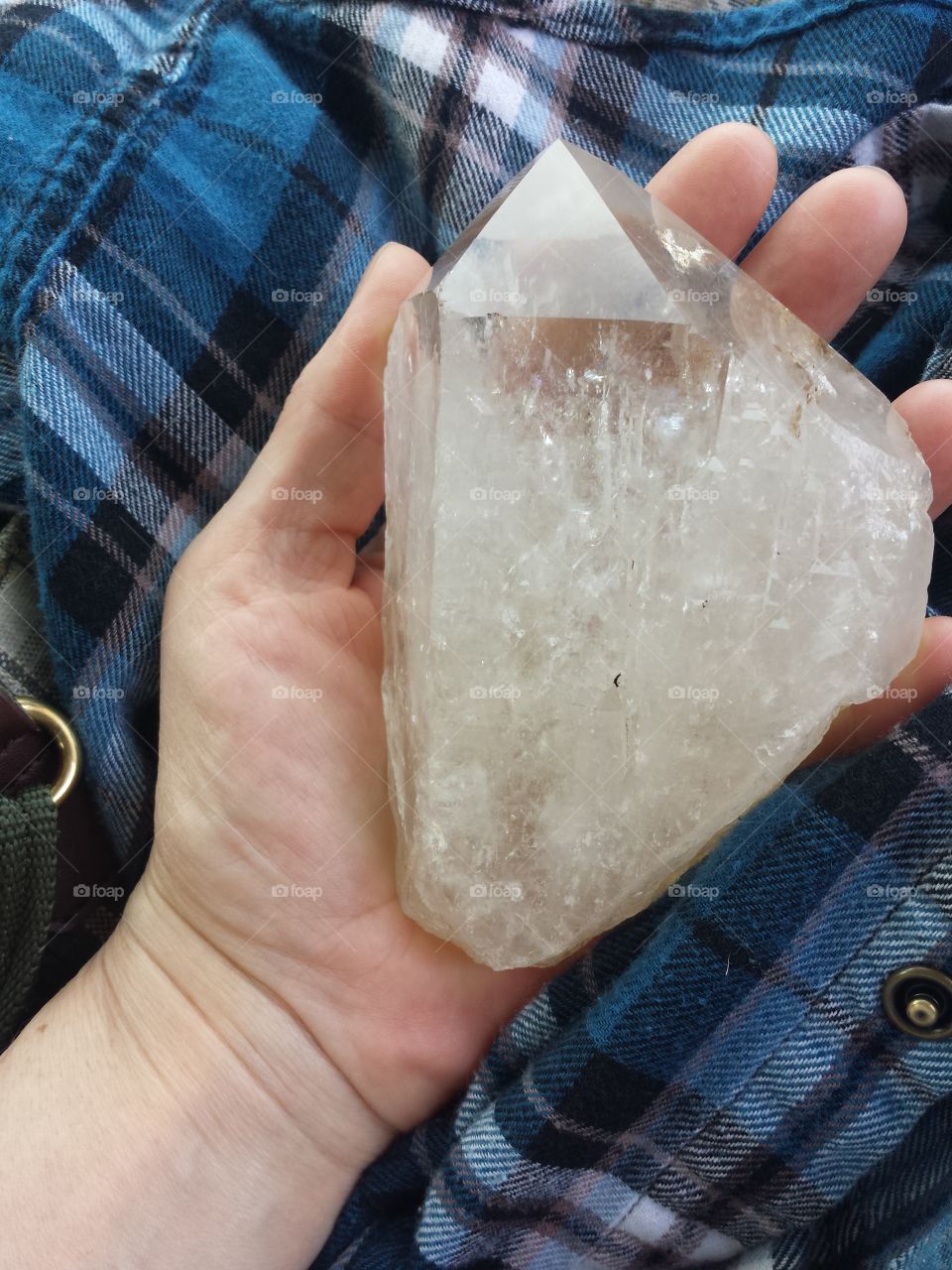 Close-up of human's hand holding gemstone