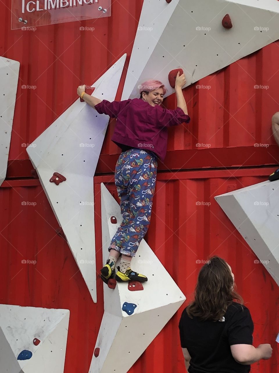 Stuck up a climbing wall. Bright colours and lots of fun to be had! 