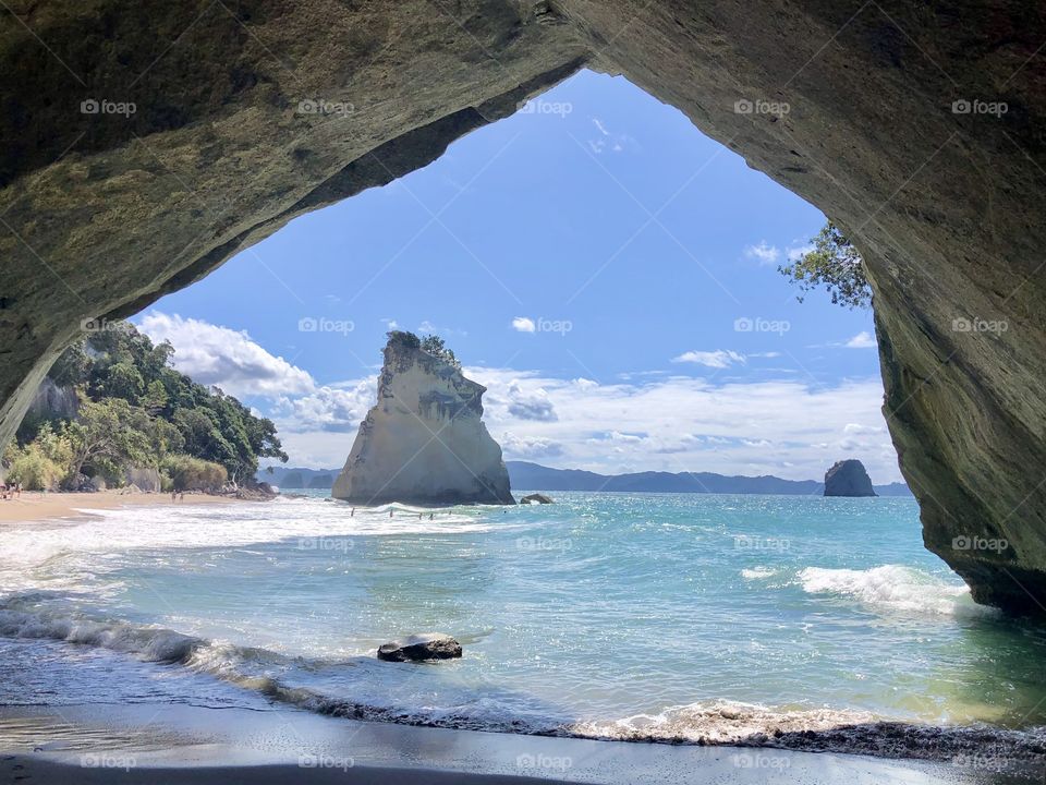 Standing under the archway and looking out at the beach at Cathedral Cove on a nice sunny day 