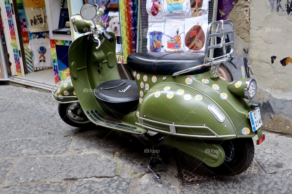 Green motorcycle park in the street