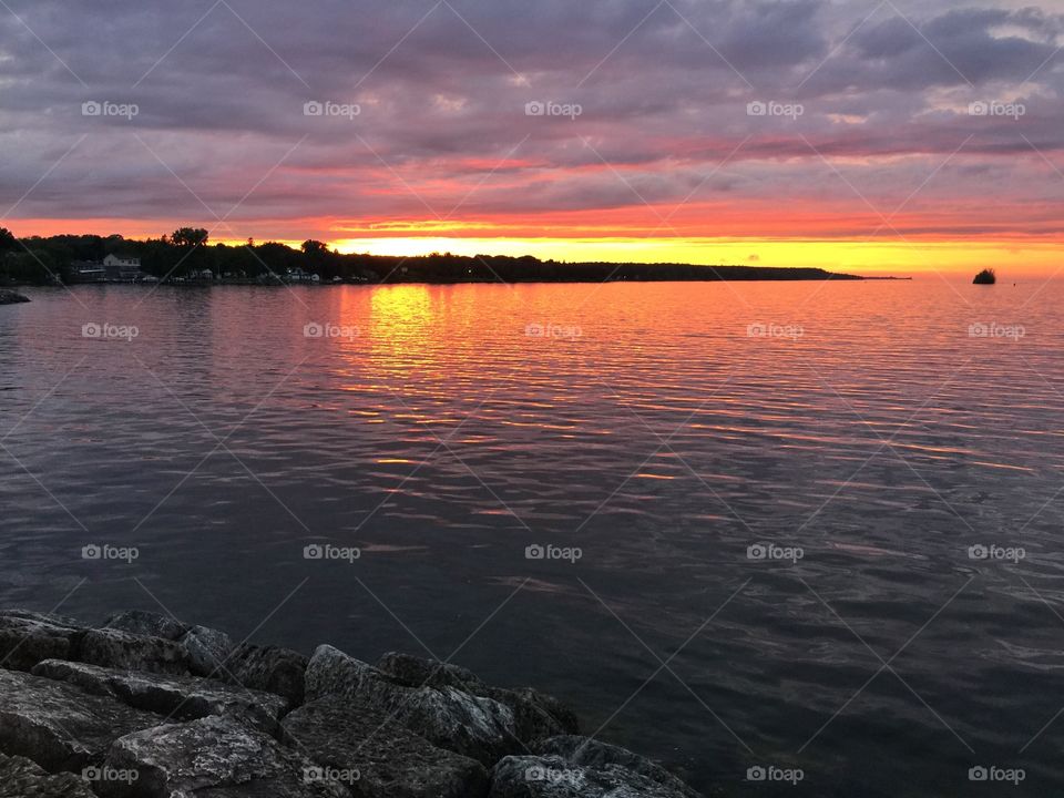 Sunset on the lake . Such a pretty night down by the lake 
