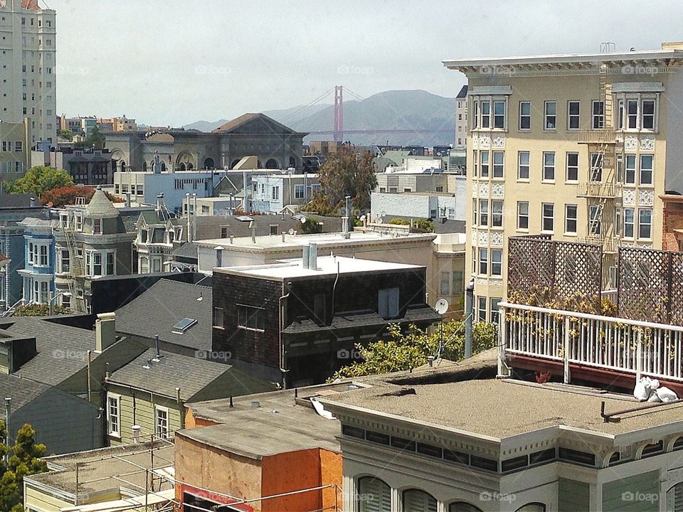 San Francisco rooftops, Golden Gate Bridge in distance. San Francisco rooftops