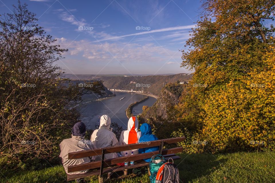 Hikers take a break with view of the Rhine valley Sankt Goarshausen and Loreley Germany 