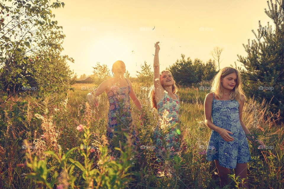 Girls playing and have fun in countryside