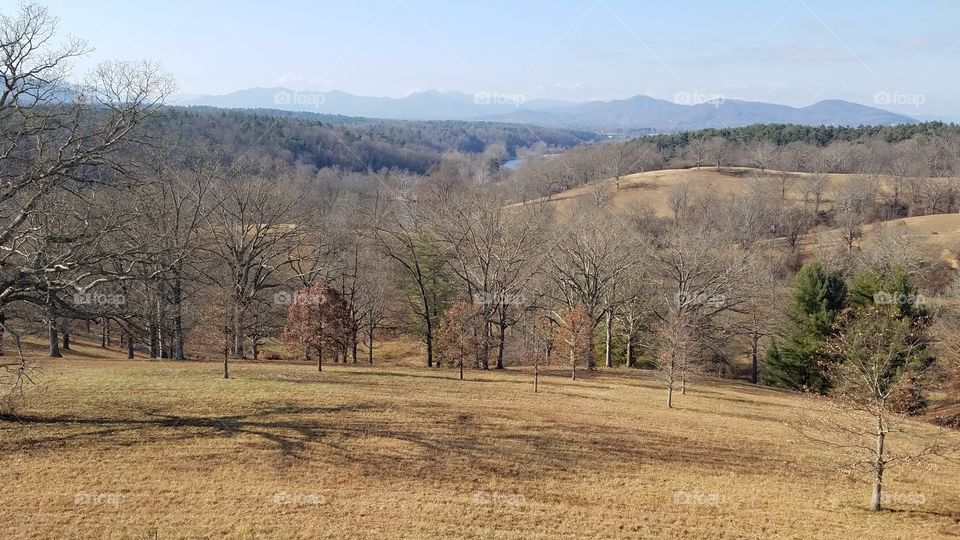 The Biltmore Forest in Asheville NC with the smokey mountains on the horizon - late autumn