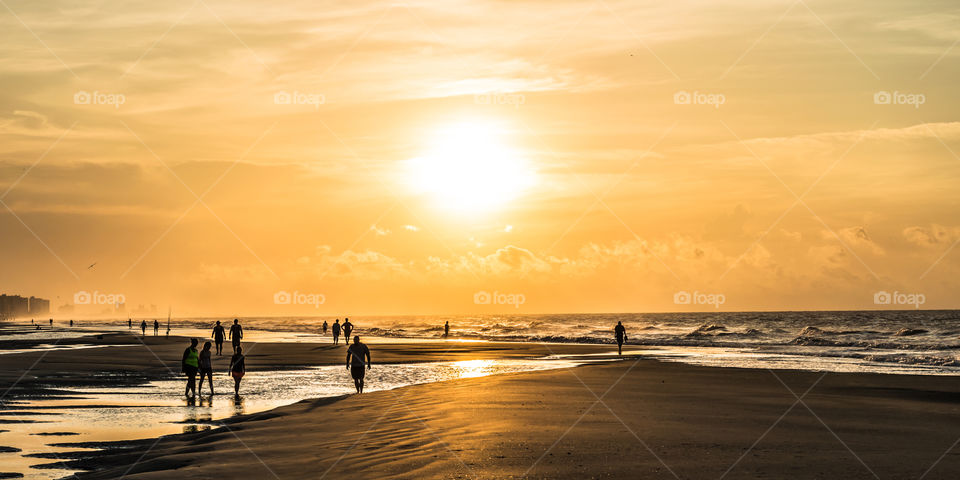 Wake up to find out that you are the eyes of the world!  Golden hues as the sun crests the Atlantic Ocean in North Myrtle Beach, South Carolina