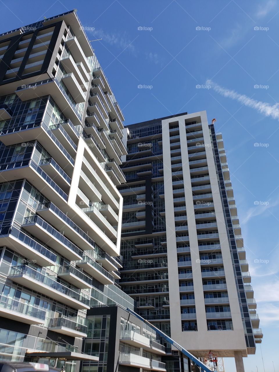 modern condominium skyscraper apartment building with blue sky
