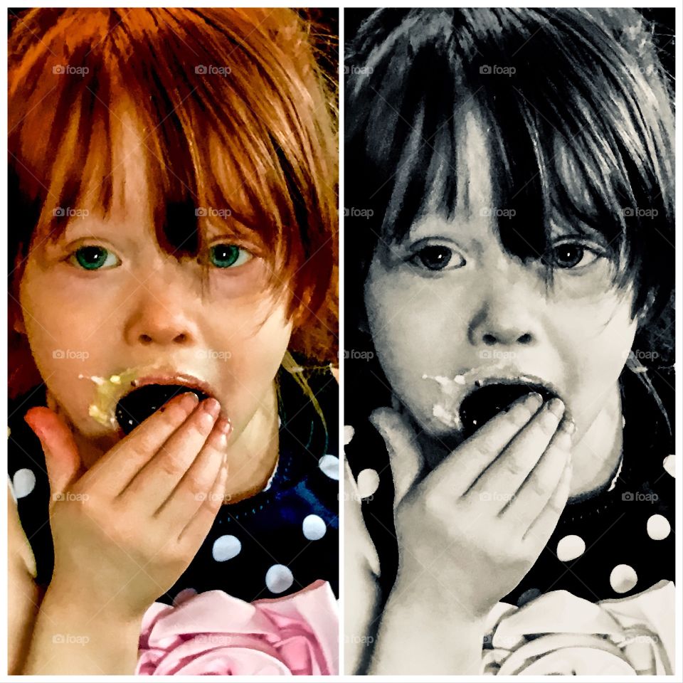 Side by shot edits of a girl child stuffing a cookie with icing into her mouth. One edit done in color the other done in black and white. 