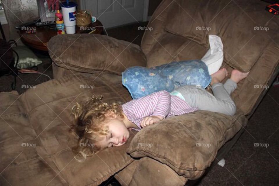 Girl sleeping on arm chair