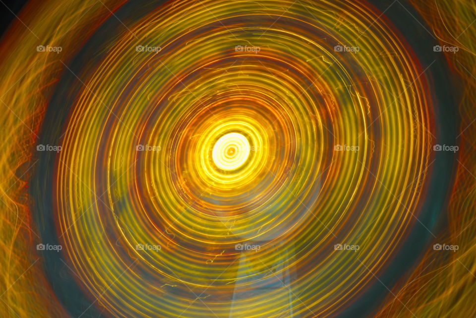 long exposure carnival night festival light motion. ferris wheel