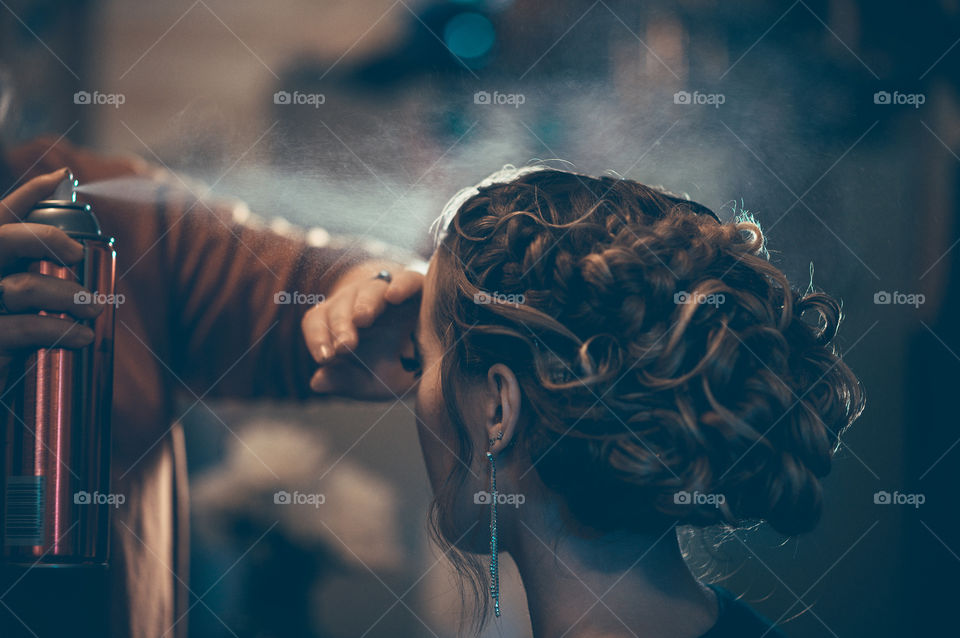 Hair we go! Beautiful image of finishing touches on a bride’s hair.