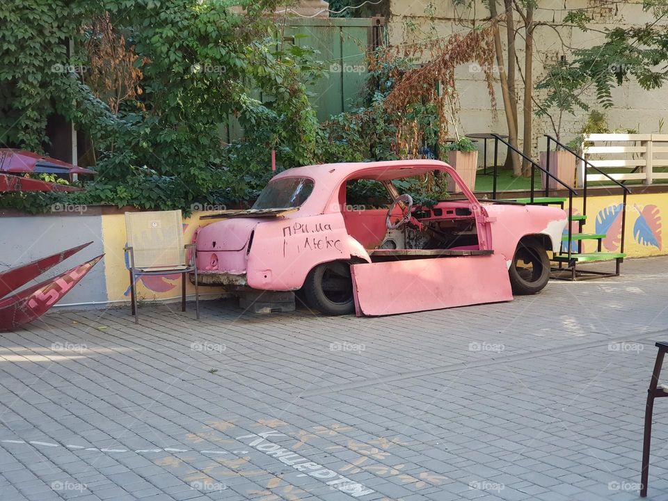 Barbenheimer? Former car of Barbie? Old, broken pink car