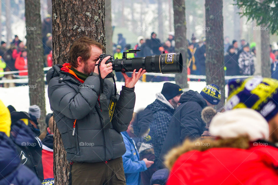 WRC Rally Sweden 2019, photographer with telephoto lens