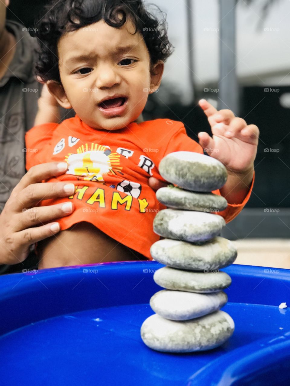 Baby watching stones