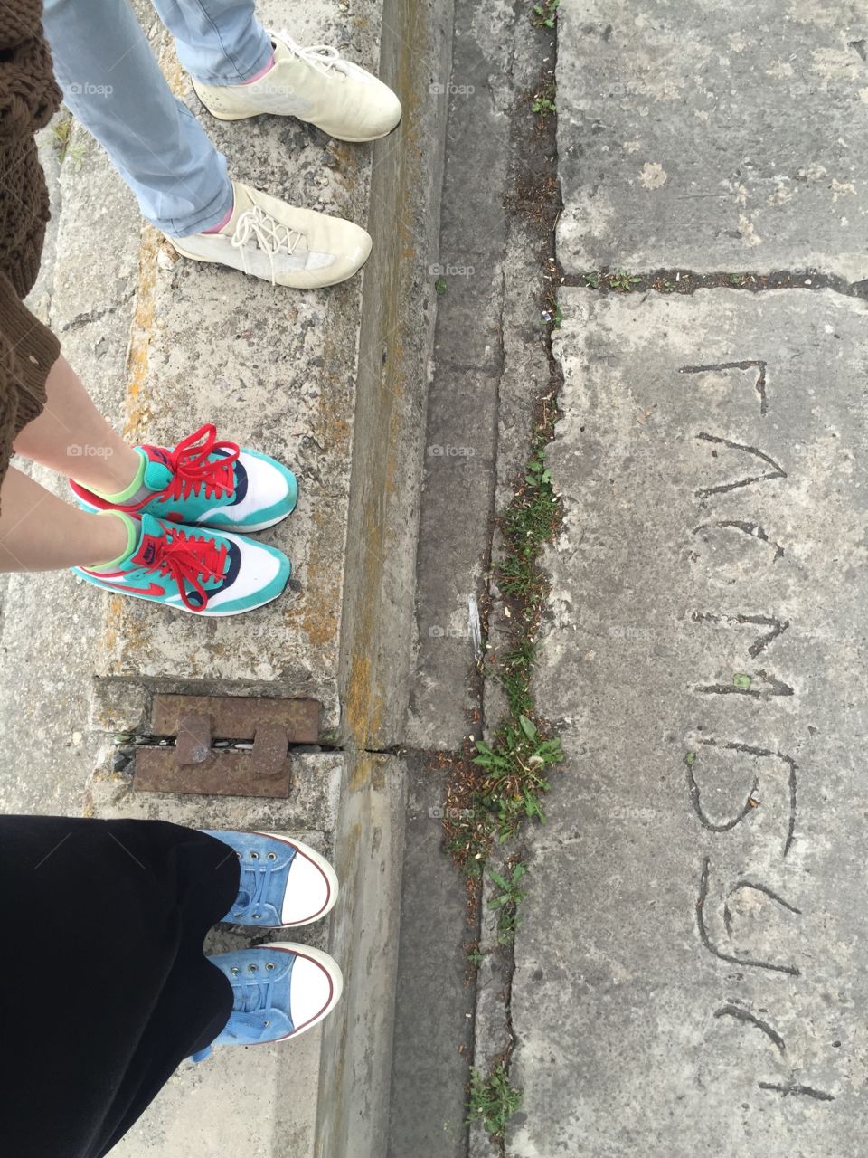 Three standing on a blockc