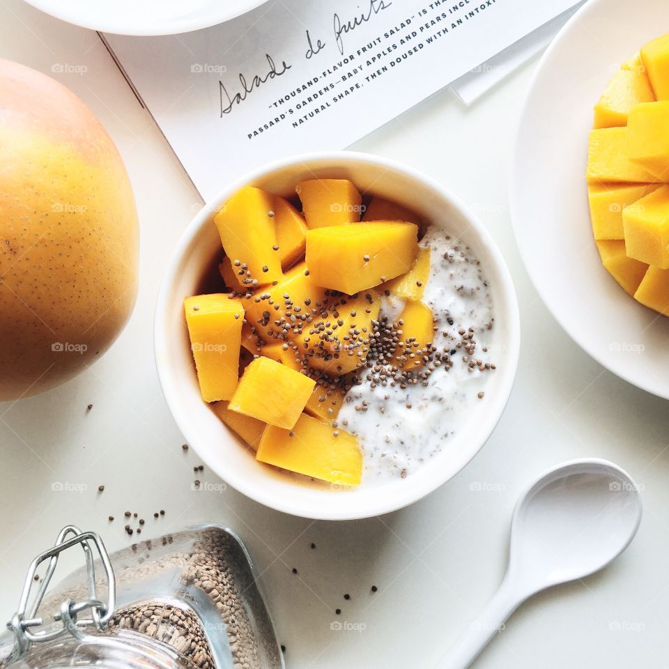 Healthy breakfast bowl with yogurt and mango.