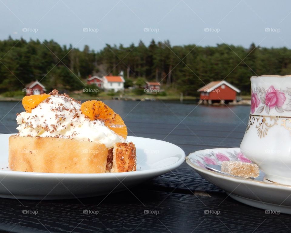 Cake and a cup of coffee. Coffee and cake by the sea