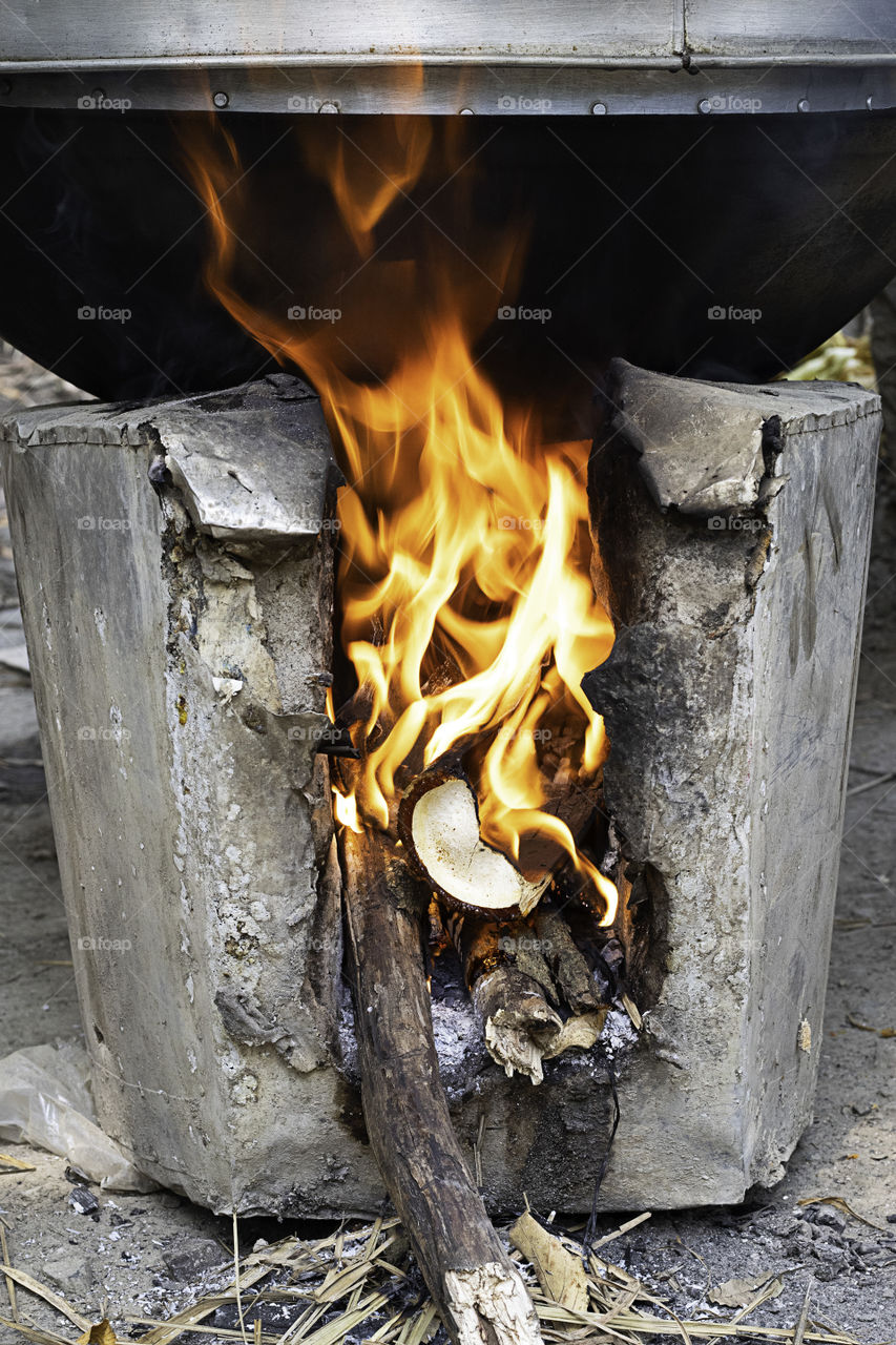 Yellow flame on the log in the oven.