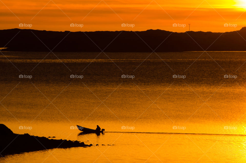 lonely fisherman in the midnightsun,