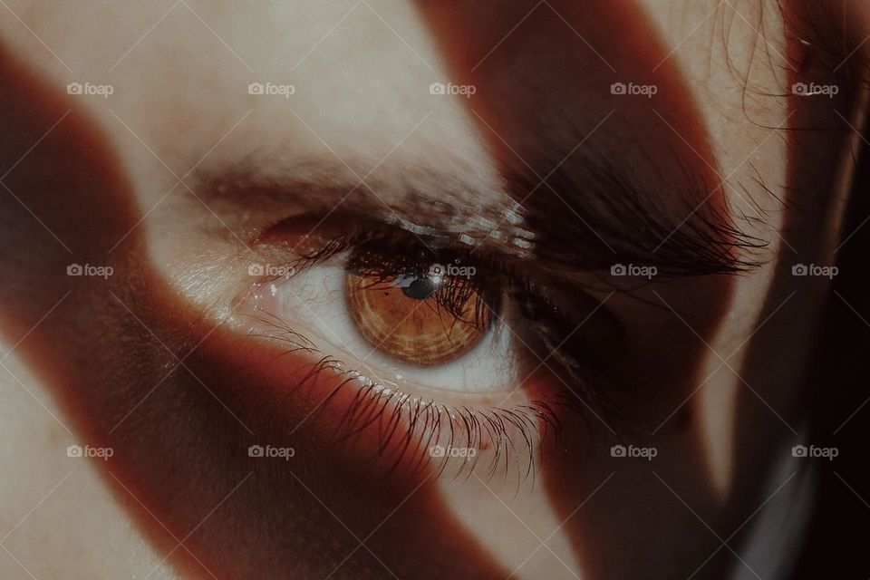 Close up of a human eye with a shadow