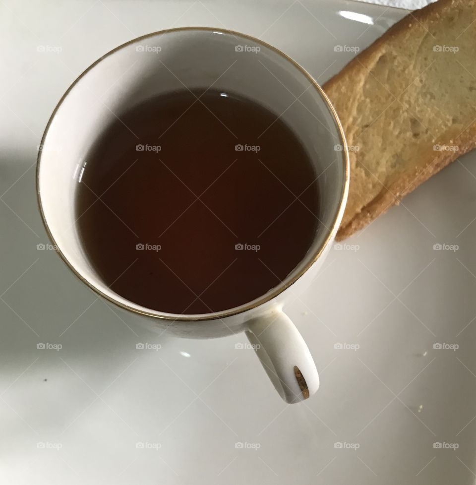 Hot tea and biscuits on plate breakfast snack food 