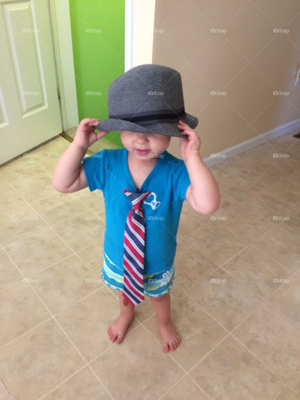 Casual formal. My 2 year old daughter found my son's clip on tie and fedora.  