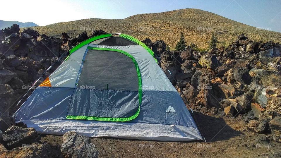 camping in a colemon tent on a volcanic lava flow in Idaho