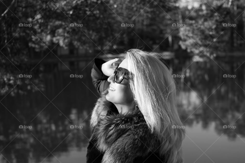 Smiling woman wearing sunglasses