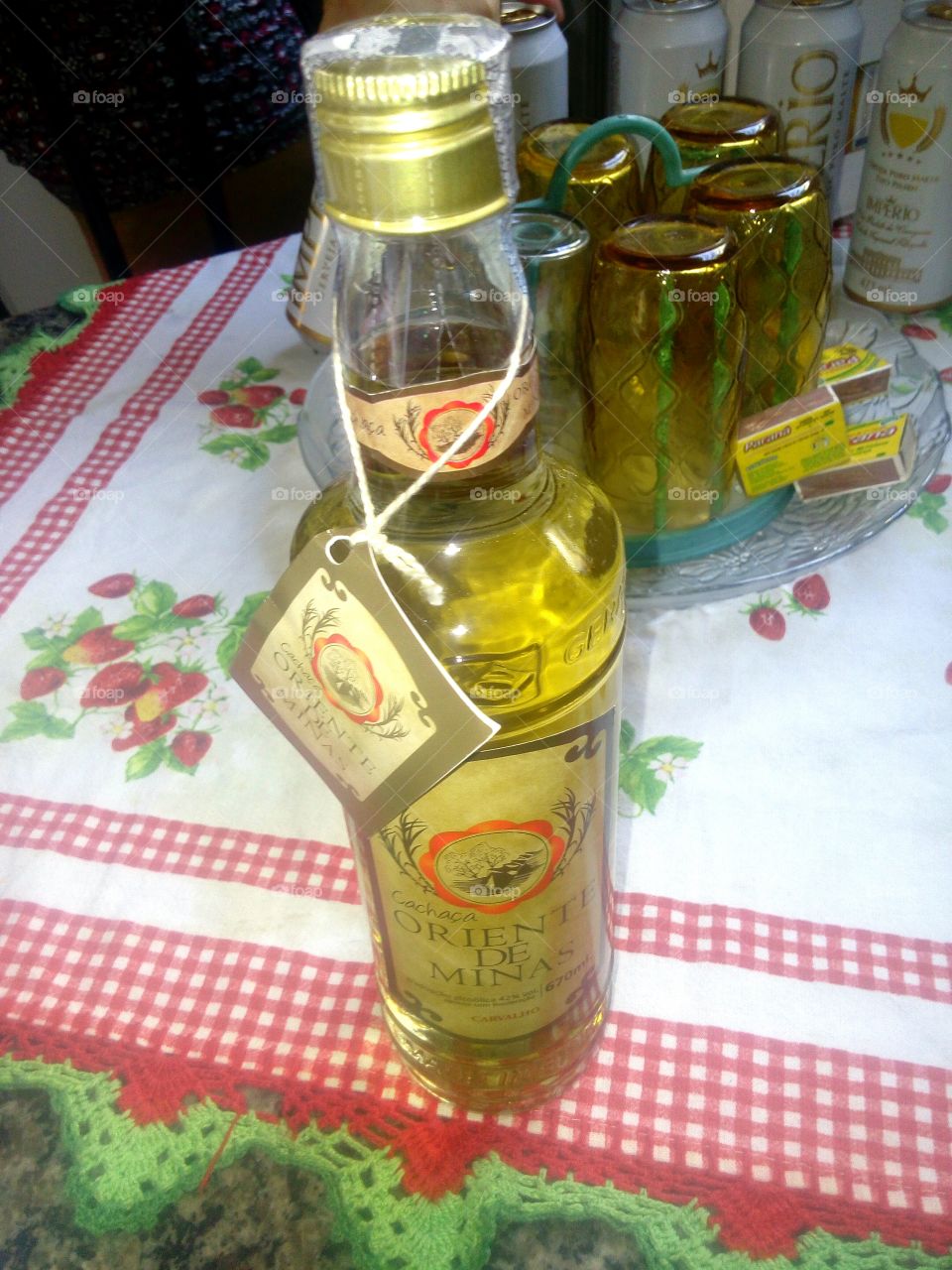 Brazilian cachaça on the table covered by red and white cloth