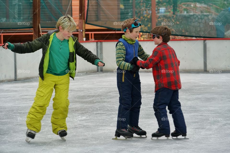 Young Boys Ice Skating