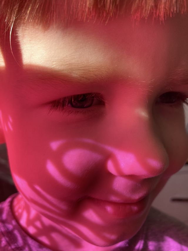 Pink shadow on the face 