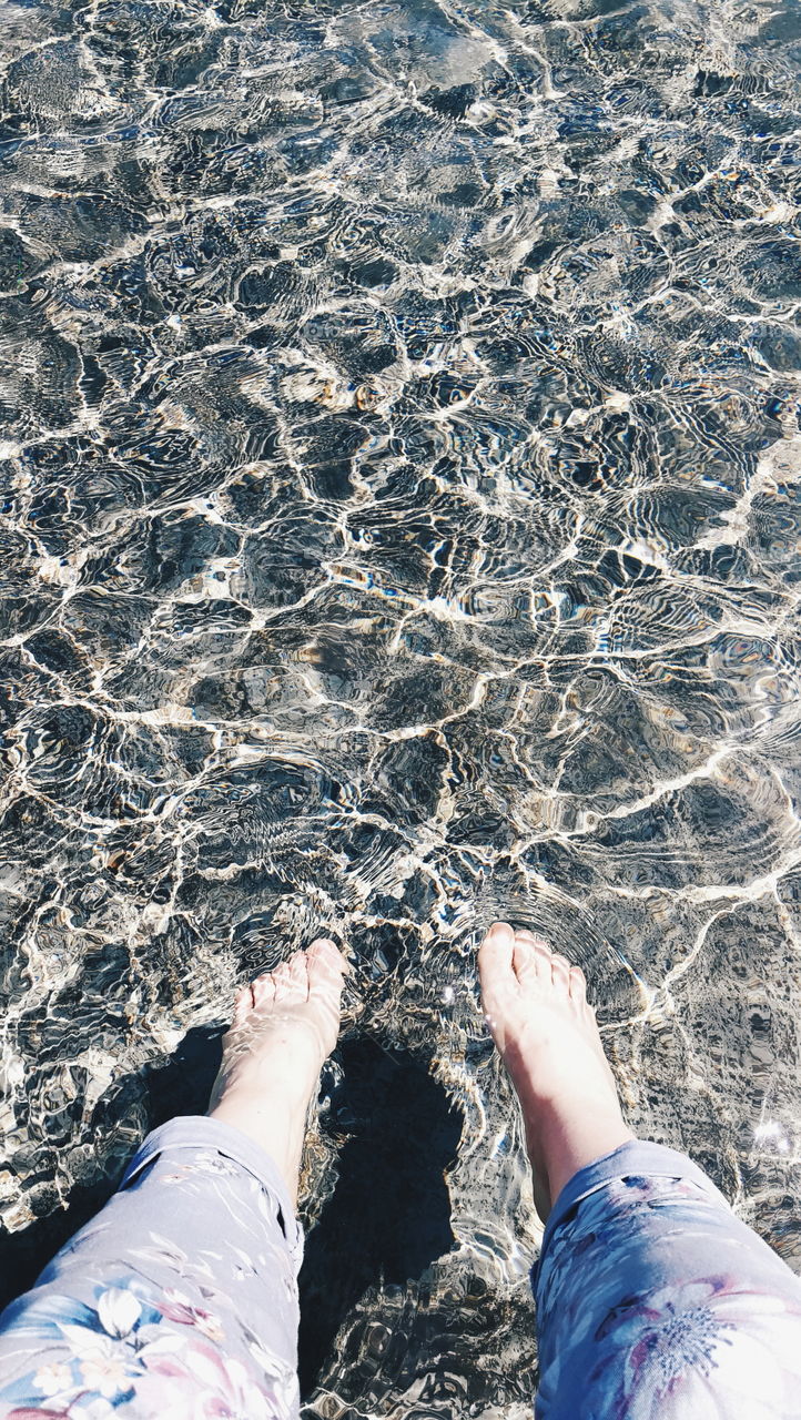 Bare feet in the water