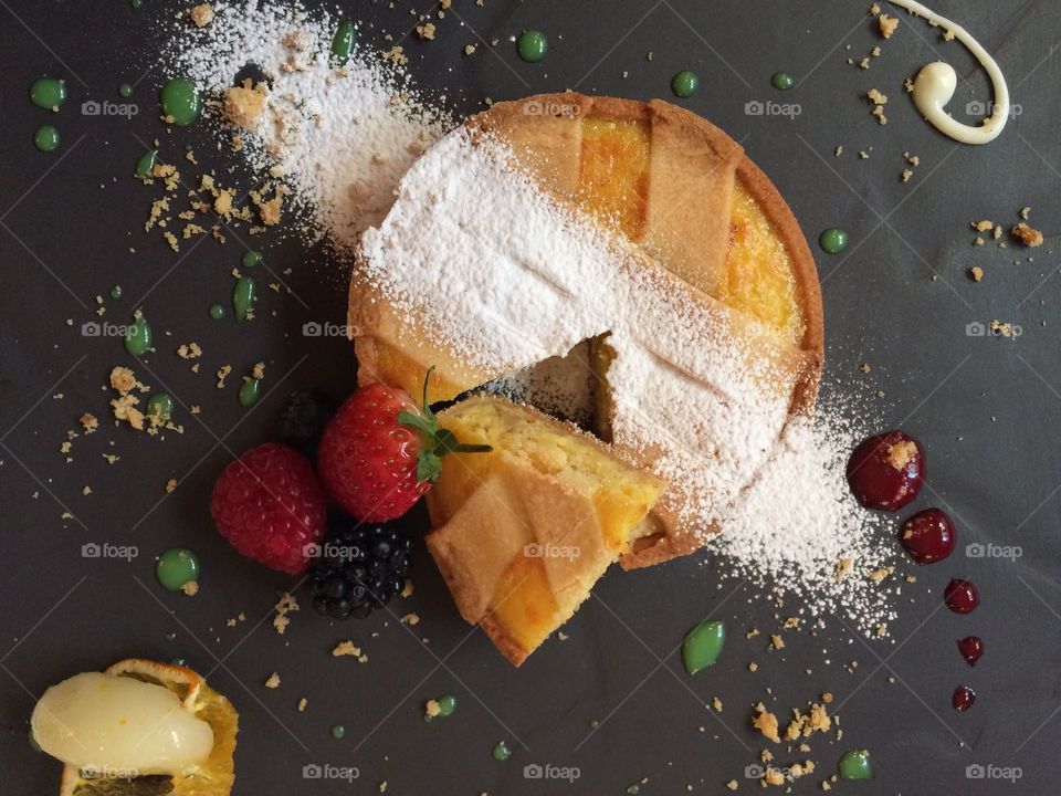 Crepe pancake with powdered sugar and fruits
