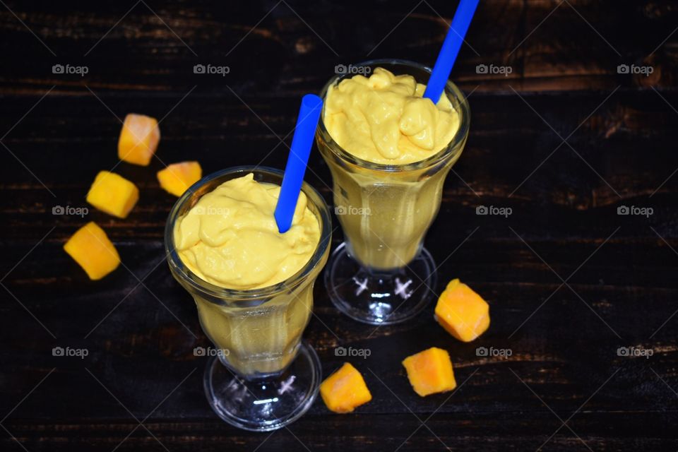 Mango smoothies with straws