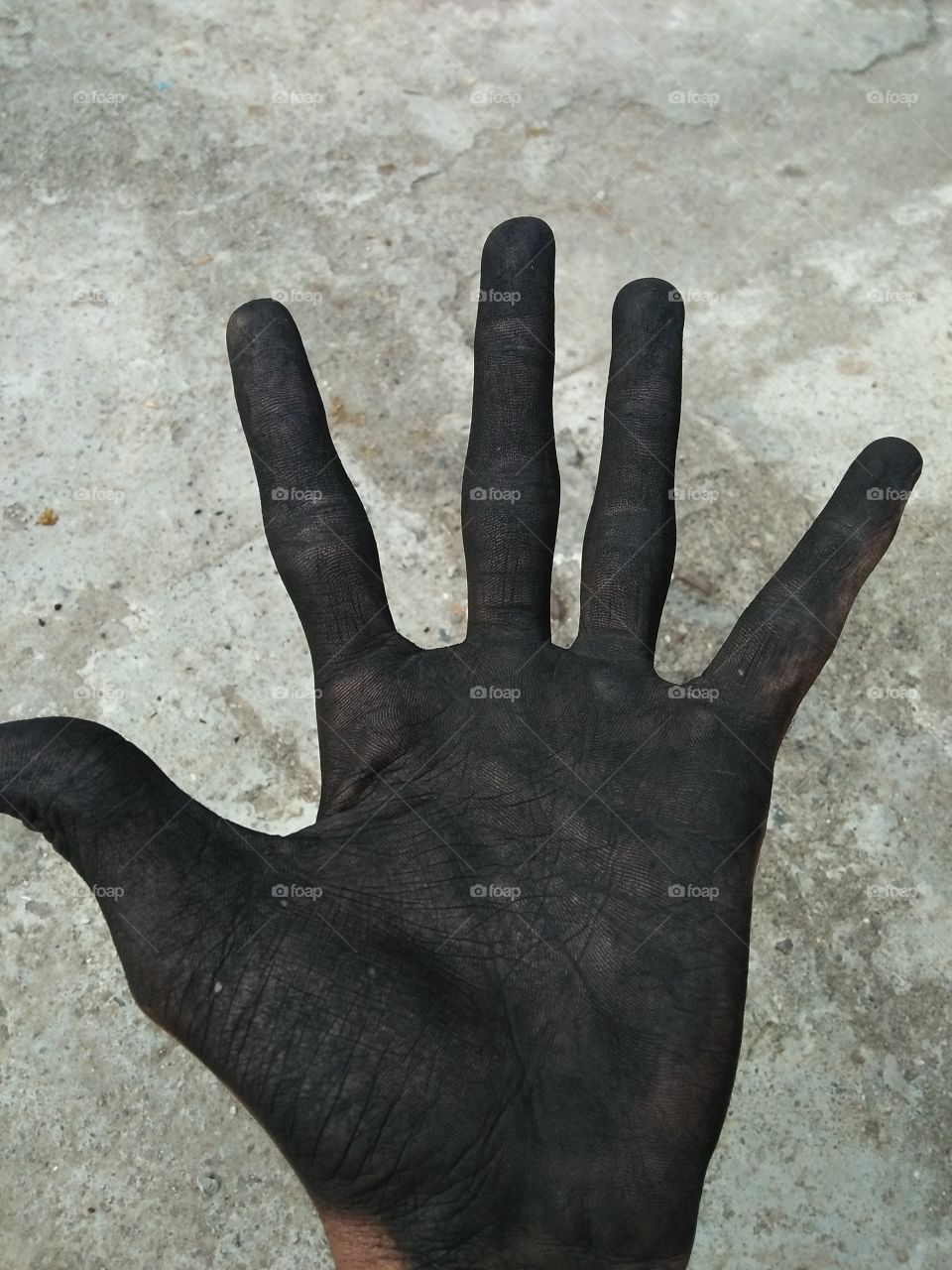charcoal with black hand