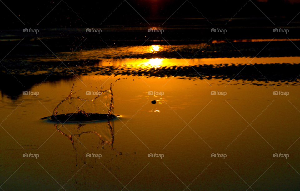 sunset water reflection stone skipping by gbp