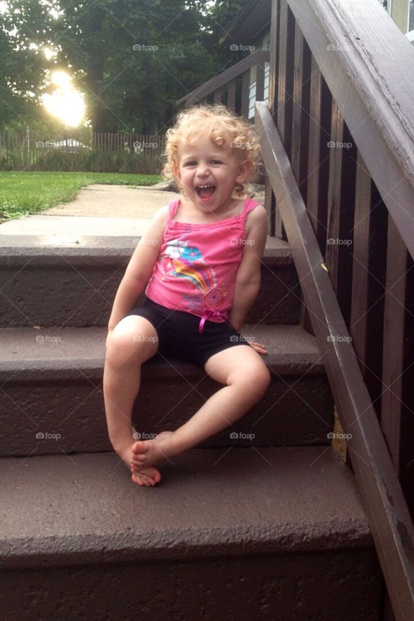 Girl sitting on stairs