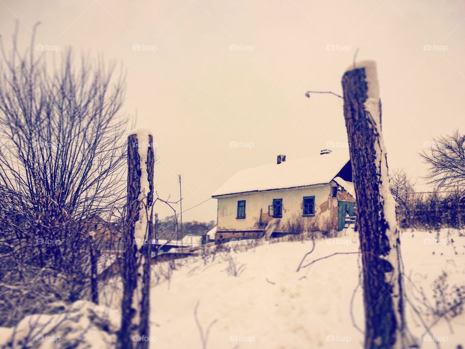 Old house in winter snow