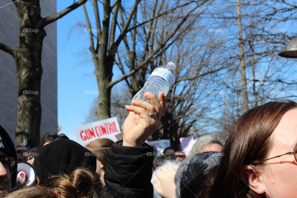 On March 24, 2018 at the March For Our Lives held in Washington, D.C., protesters come together to pass out free water to fellow parched allies. 