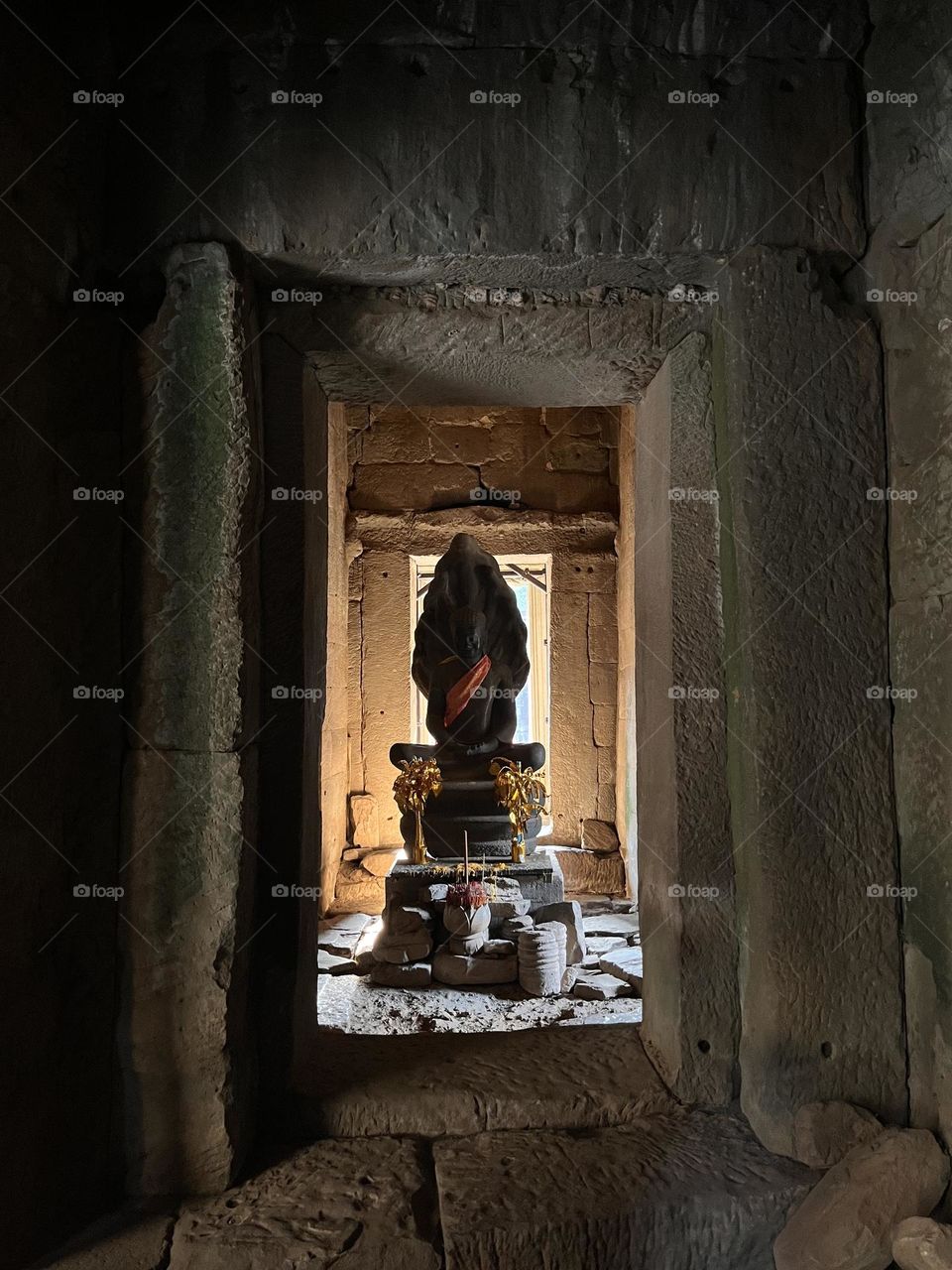 Beautiful a ancient stone Buddha inside the temple of Angkor   