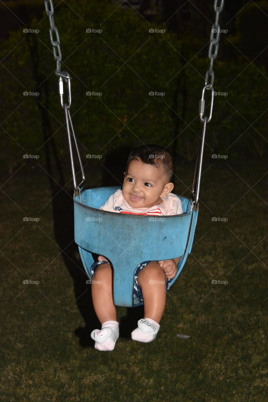 Happy Child In the Swing