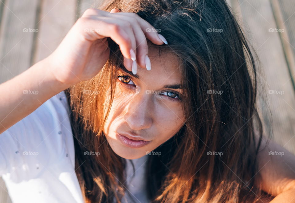 Close-up of young woman looking up