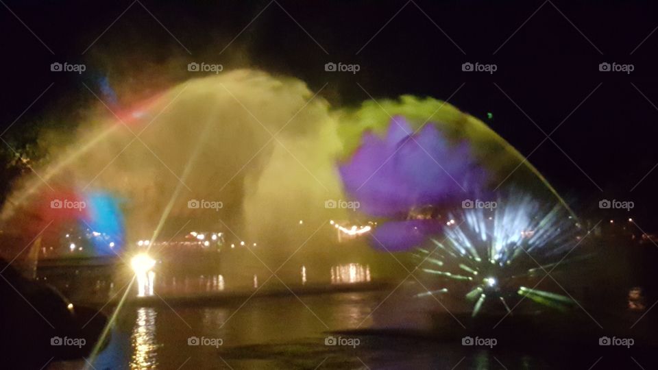 Misty water carries light high into the night sky above Discovery River during Rivers of Light at Animal Kingdom at the Walt Disney World Resort in Orlando, Florida.