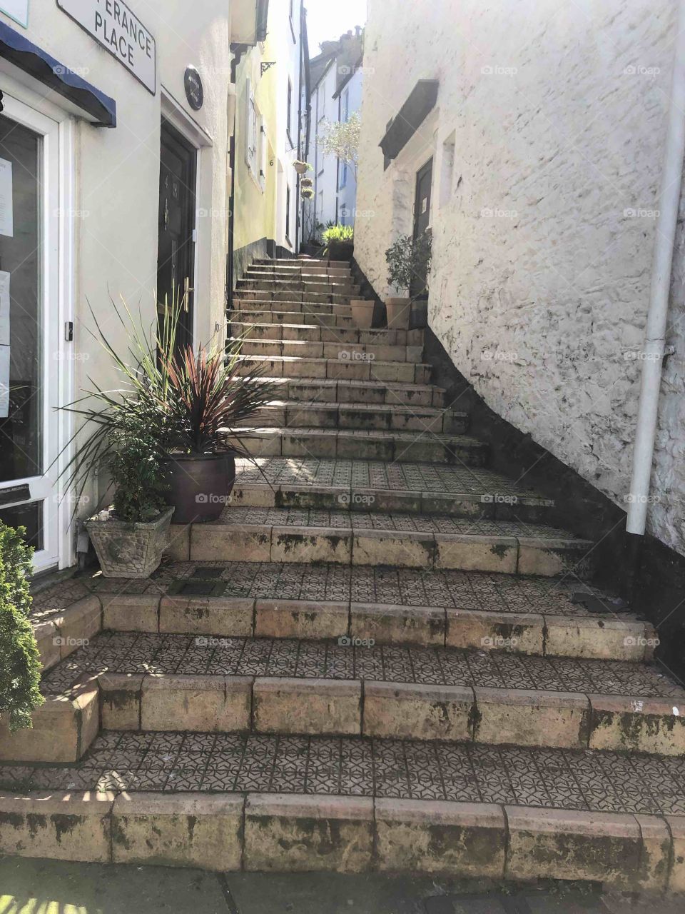 Attractive climb found in the busy fish market town of Brixham in Devon.